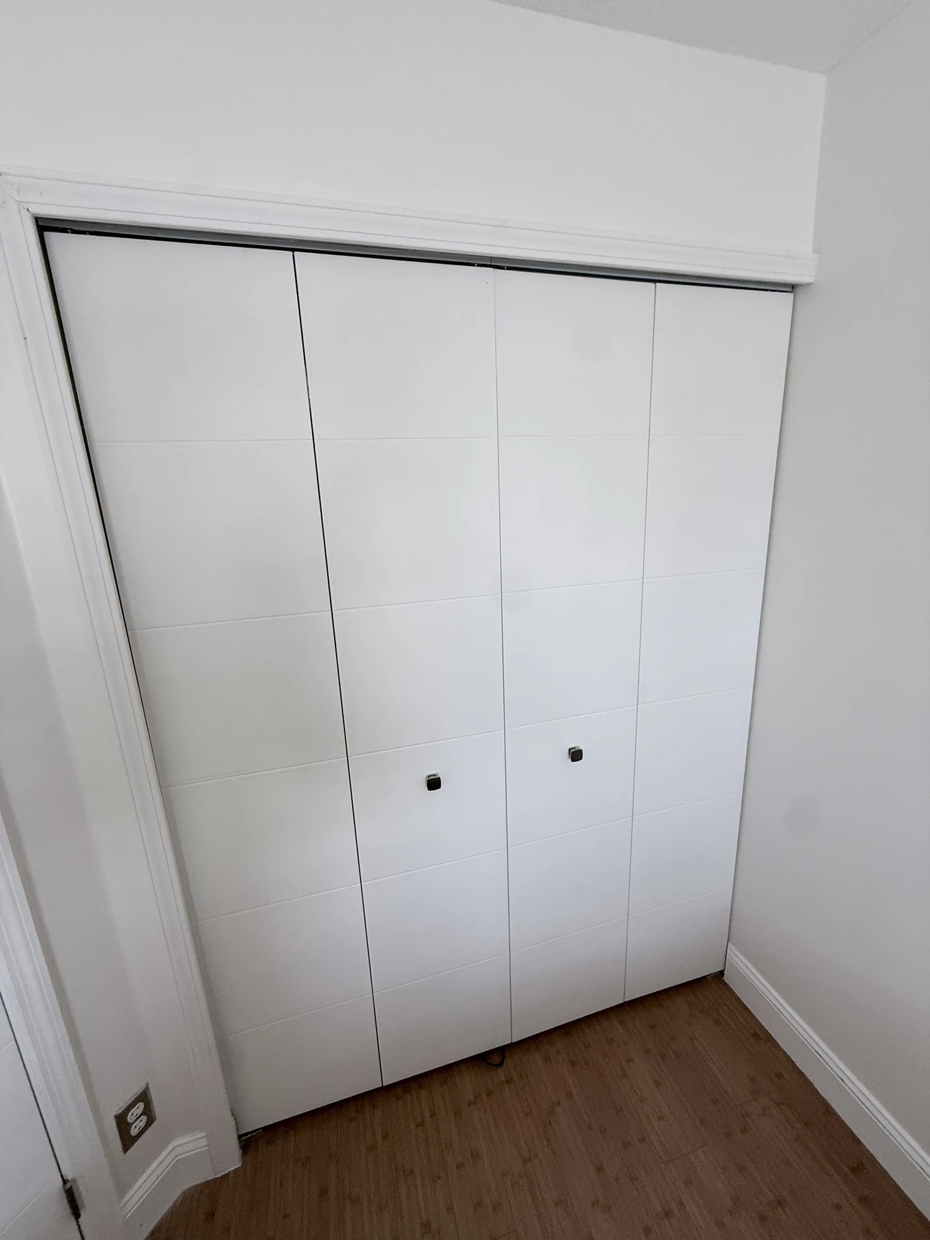 White four-panel bifold closet doors