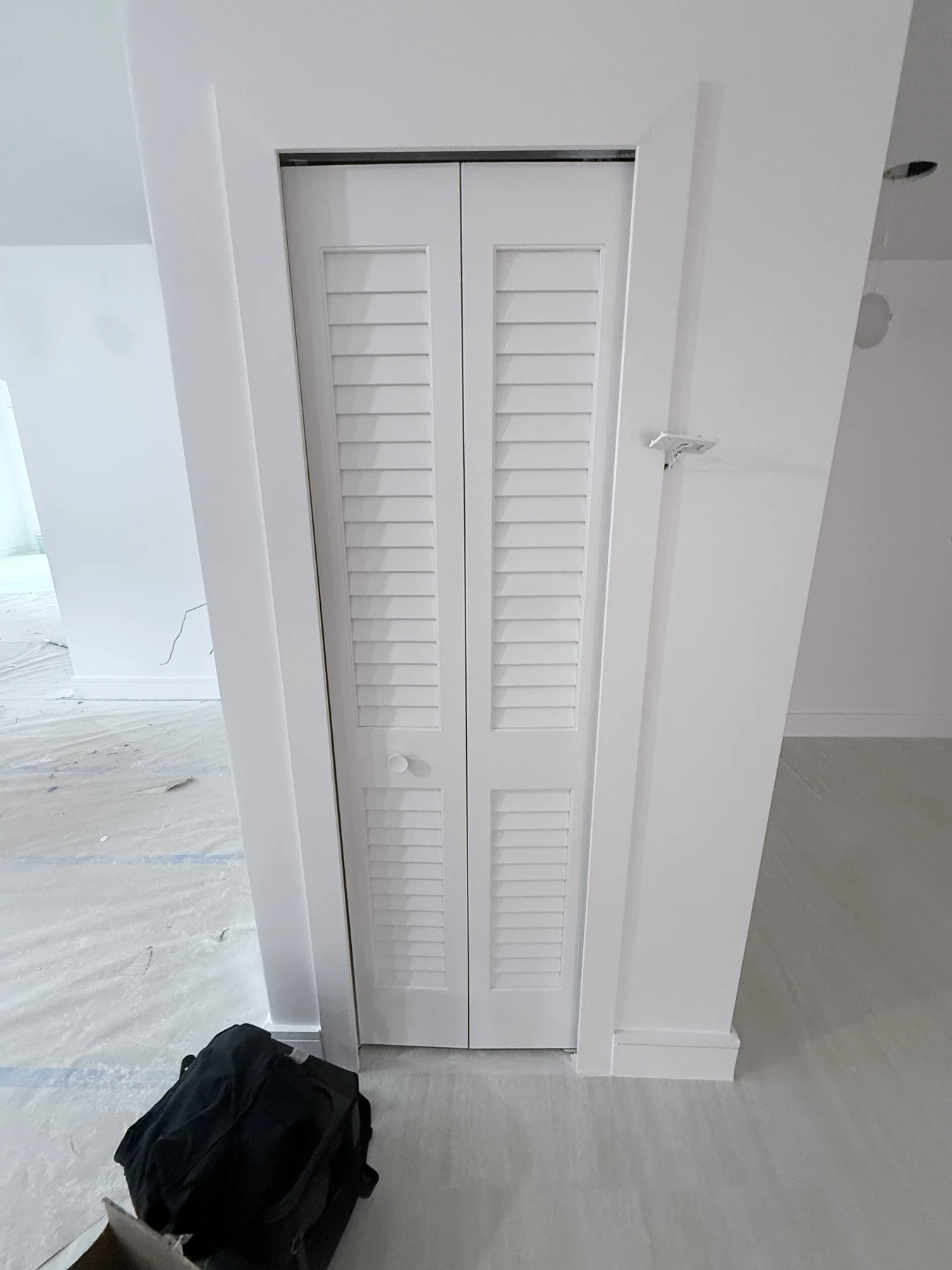 Louvered bifold utility closet door